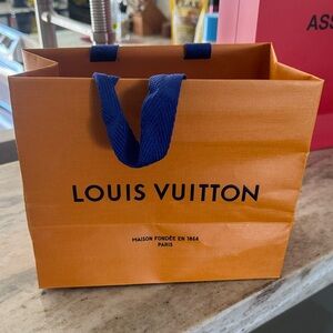 Louis Vuitton Vibrant Orange Bag with Bold Blue Handles